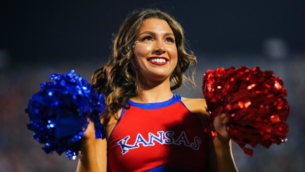 Sep 8, 2023; Lawrence, Kansas, USA; A Kansas Jayhawks cheerleader performs during the second half against the Illinois Fighting Illini at David Booth Kansas Memorial Stadium. Mandatory Credit: Jay Biggerstaff-USA TODAY Sports  